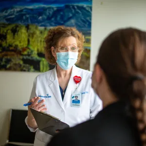 Physician talking with a patient.