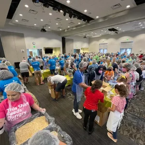 AdventHealth volunteers packing meals for Ukrainian refugees.