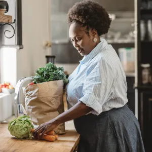 A woman unpacking her groceries. 