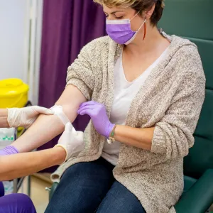 A woman donating blood.