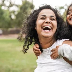 woman-smiling-with-girl-breast-cancer