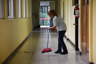 An AdventHealth team member sweeps the floor at the malnutrition center in Guatemala.