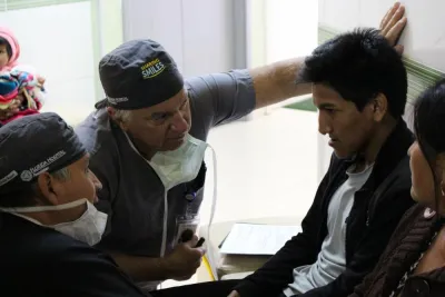 A doctor examines a man