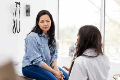 A woman talks to her doctor.