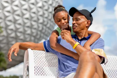 Father and Daughter at Epcot eating Ice Cream