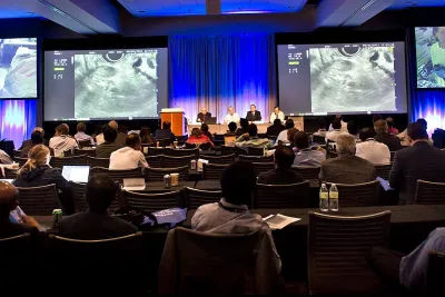 Professionals attending a conference in a Nicholson Center Eduction Center room.