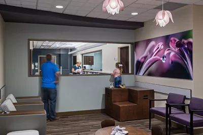 Family viewing a newborn baby in a nursery at AdventHealth Gordon