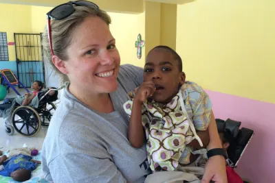 a woman holds a child