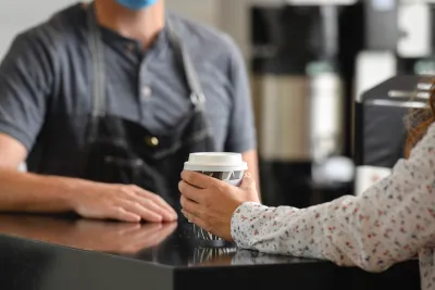 Barista serving coffee