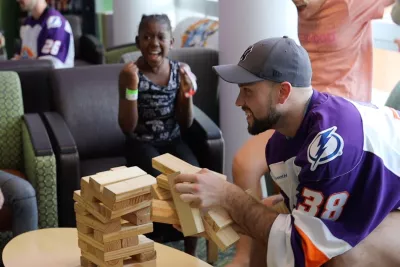 Solar Bear Player visiting pediatric patient at a hospital.