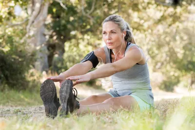 Person doing stretching exercises outdoors