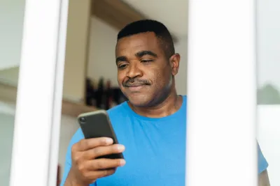 Man reading iPhone 
