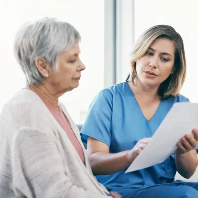 A Provider Goes over a Document with a Patient
