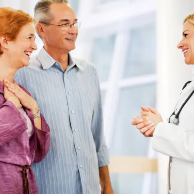 Mature couple getting good news from doctor