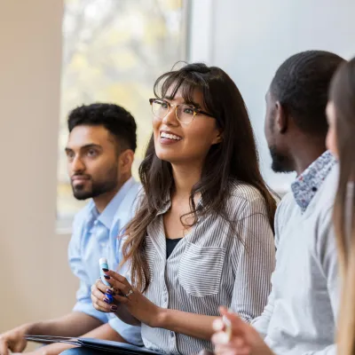 A Group of Young Professionals Having a Group Discussion in a Class.