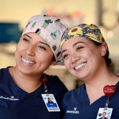 Two AdventHealth nurses smiling together