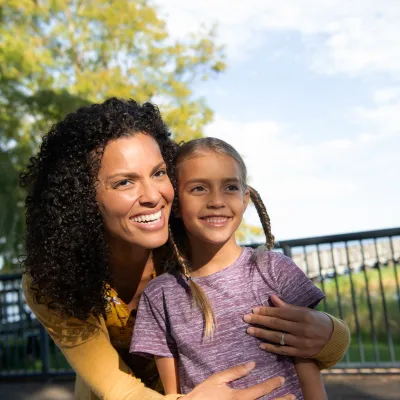 A Mother and Daughter Enjoy the Park on a Sunny Day