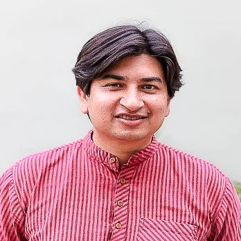 picture of employee Anurag Mani in red shirt