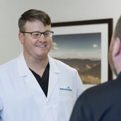 blake olson speaks with a patient