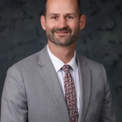 Headshot of Cory Reeves.
