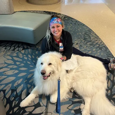 Duke McDreamy comforts an AdventHealth team member. 