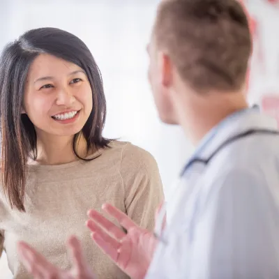 Patient talking with her doctor.