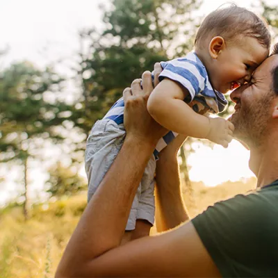 Father holding son