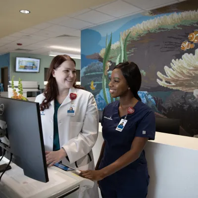 AdventHealth Employees at the FLAMINGO CROSSINGS Town Center front desk