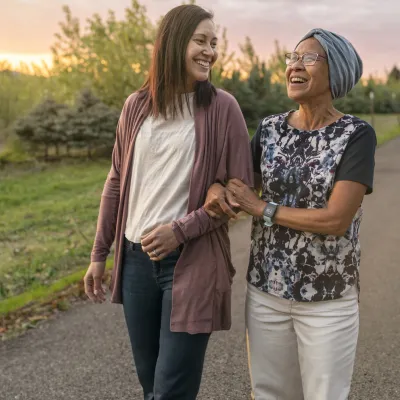 Mother and Daughter Walking Outdoors