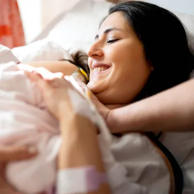 Mom giving birth in the hospital.