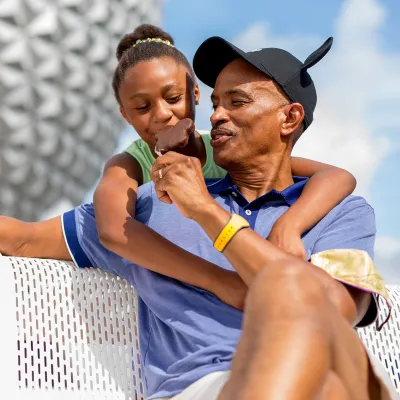 Father and Daughter at Epcot eating Ice Cream