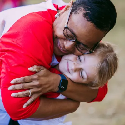 Mrs. Carlene Honor hugs Kennedy Vogt at the Greater Orlando Heart Walk.