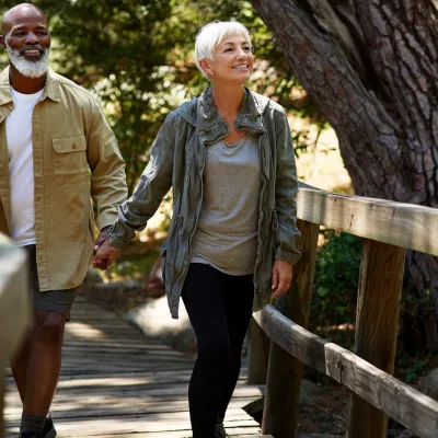 A couple on an outdoor walk together.