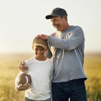 Father and Son Playing Football.