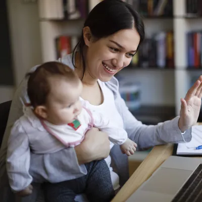 A mom and her baby have a video visit with a pediatrician.