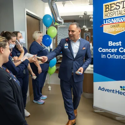 Dr. Victor Herrera celebrates U.S. News rankings with team members