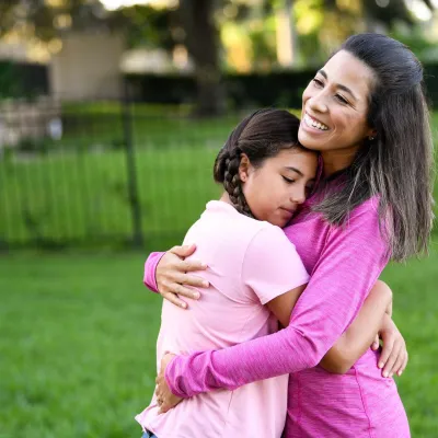 Woman holding her daughter 