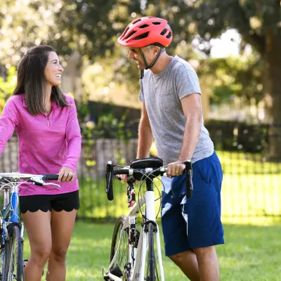 Couple riding on bikes.