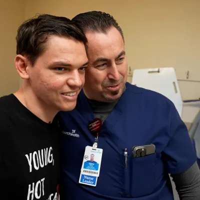 Josiah Stubbs visits Jayme Cluka, AdventHealth Daytona Beach ICU nurse manager.