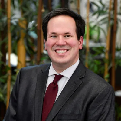 Headshot of Justin Collins, PharmD