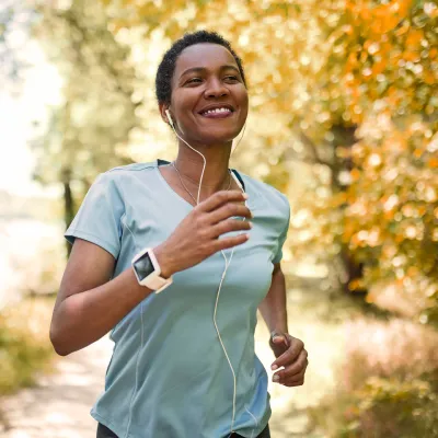 Woman running while listening to music