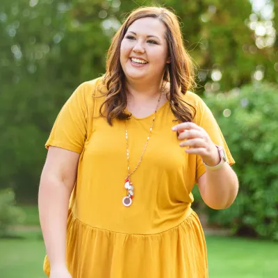 woman outside in yellow dress