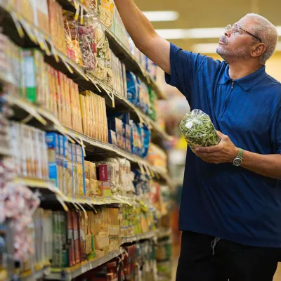 Man at the supermarket shopping for food