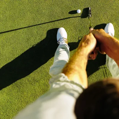 man-playing-golf- ready to put