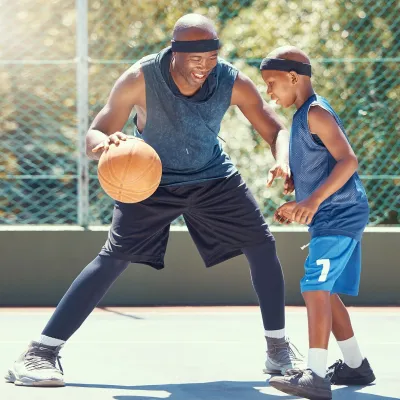 Ortho Sports Med Father son playing basketball