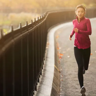 Woman Running on pathway