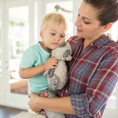 Mom holding her child.
