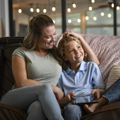 Mother and child sitting on a couch