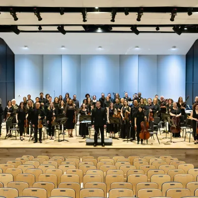 AdventHealth Orchestra on an indoor stage.