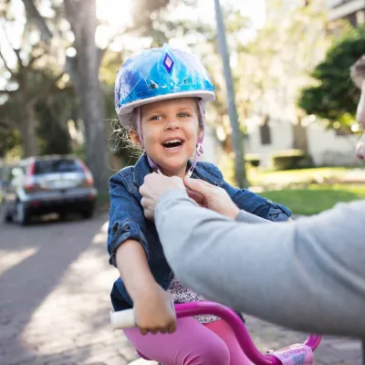 Dad taking his daughter on a bike ride.